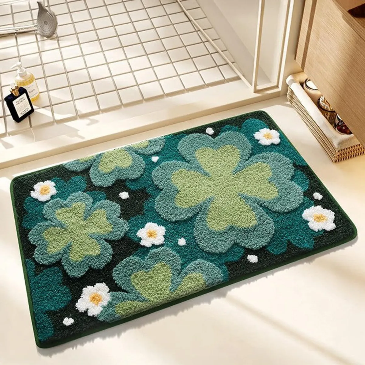 Close view of the blue and green floral bath mat with raised textured flowers.