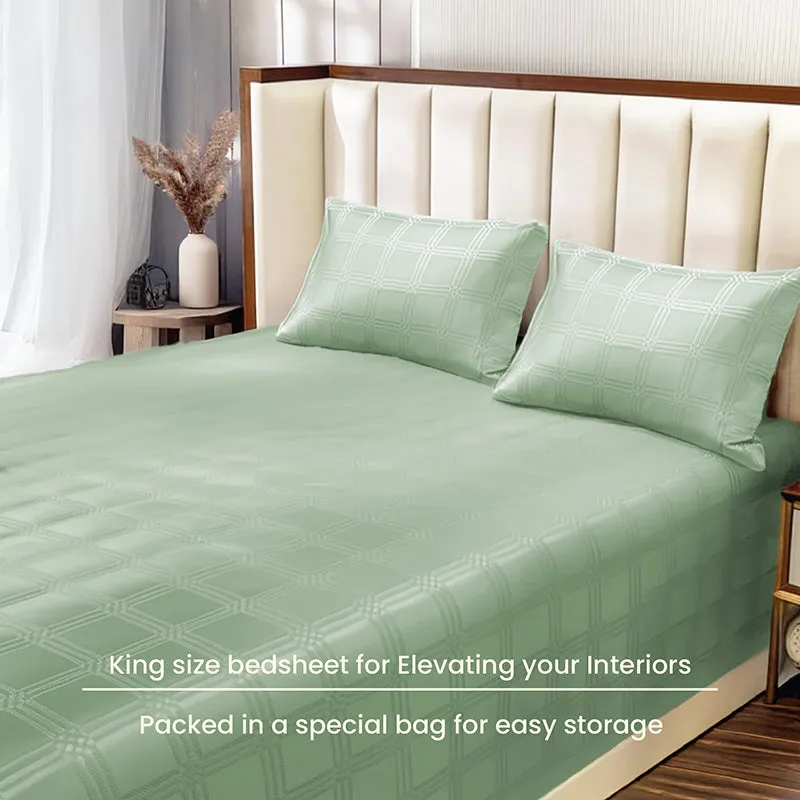 Sage green King bedsheet with matching pillow covers on a styled bed