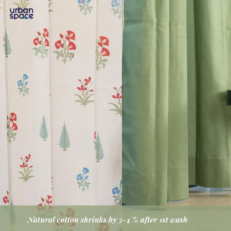 Close-up of floral cotton curtain fabric beside a green panel