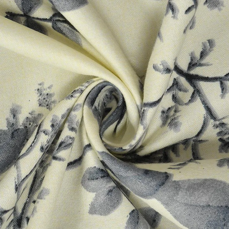 Close-up of cream bedsheet fabric with grey floral print