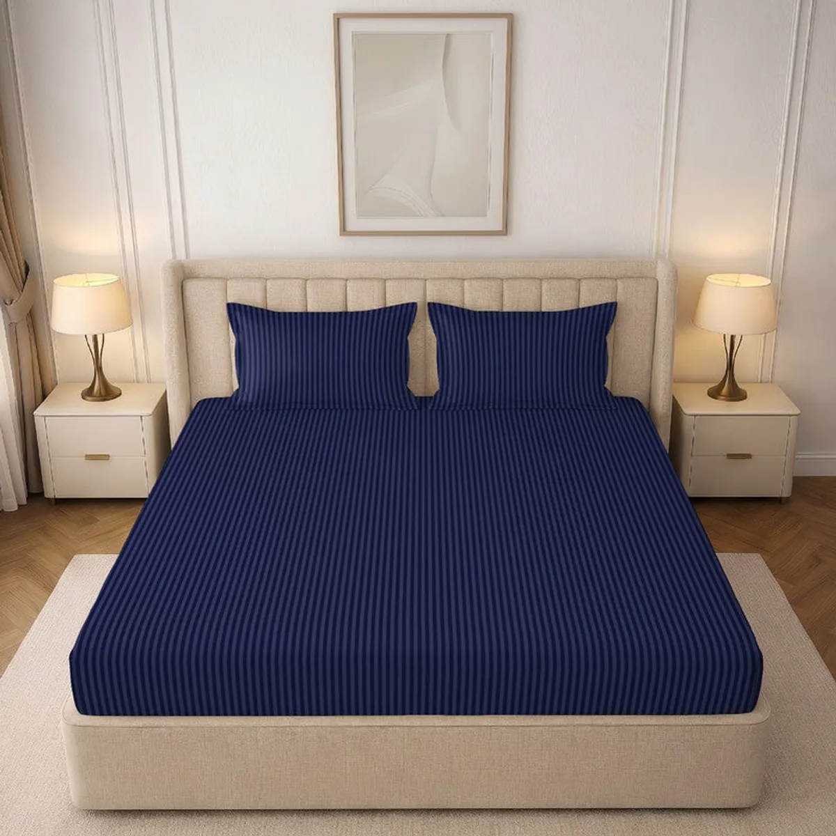 Navy striped bedsheet styled on a cream bed with two matching pillow covers