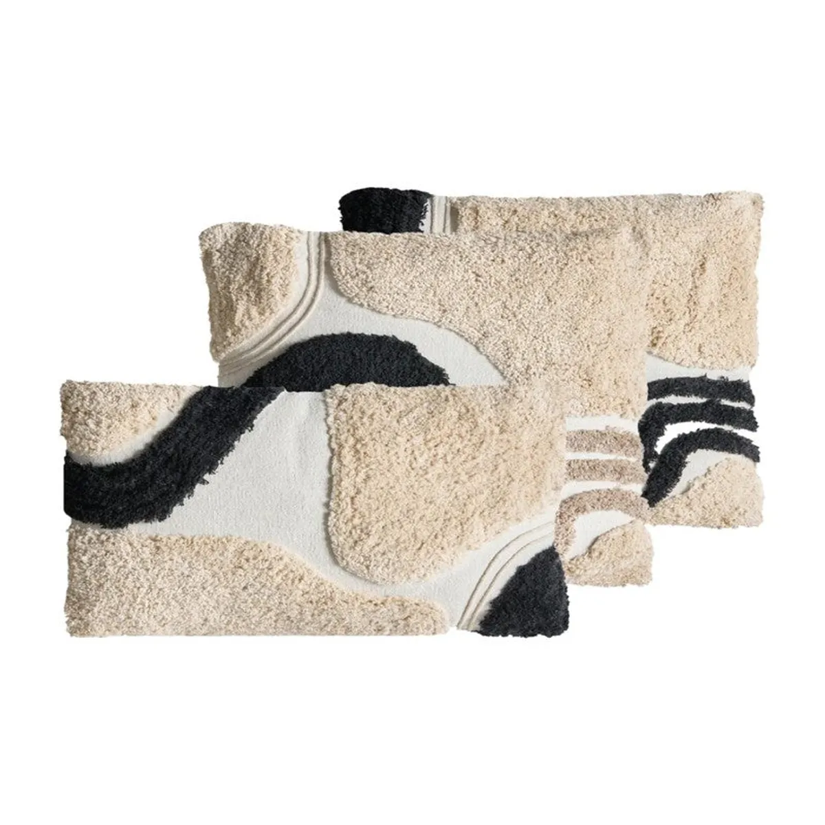 Three abstract tufted cushion covers arranged together against a white background