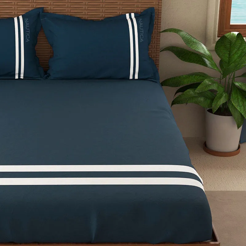 Close view of navy bedsheet with two white stripe bands