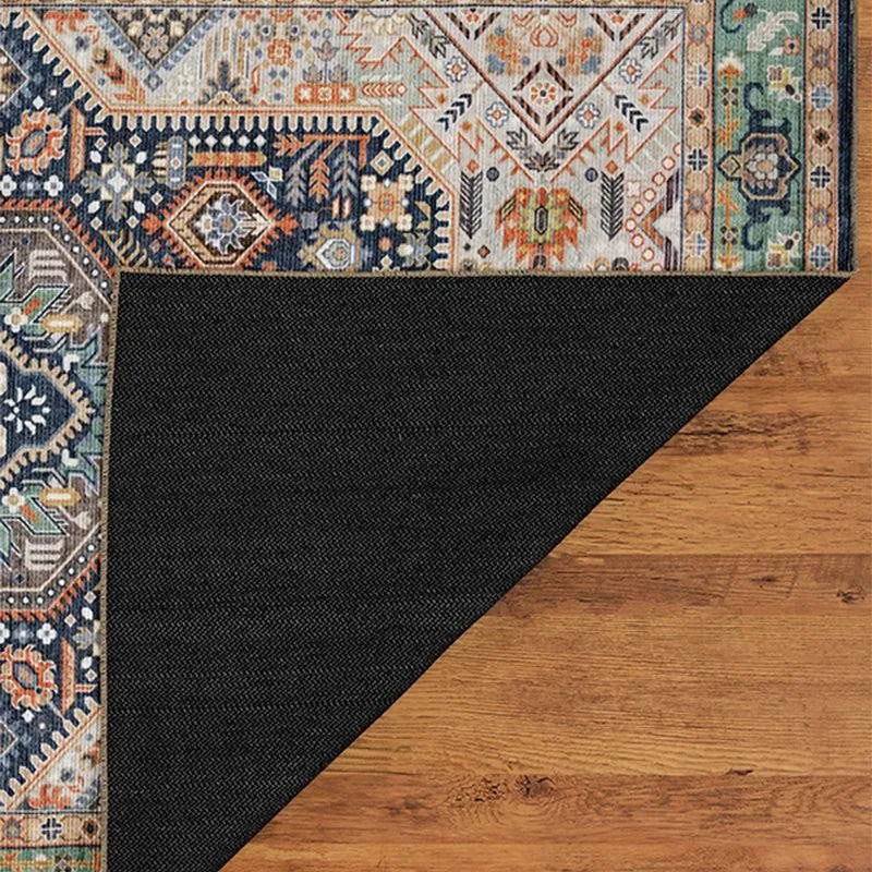 Back corner of carpet folded to show black underside