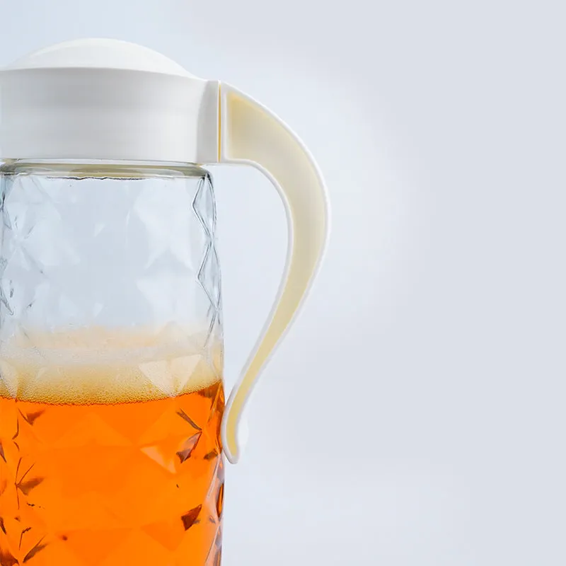 Close-up of transparent textured jug with curved white handle