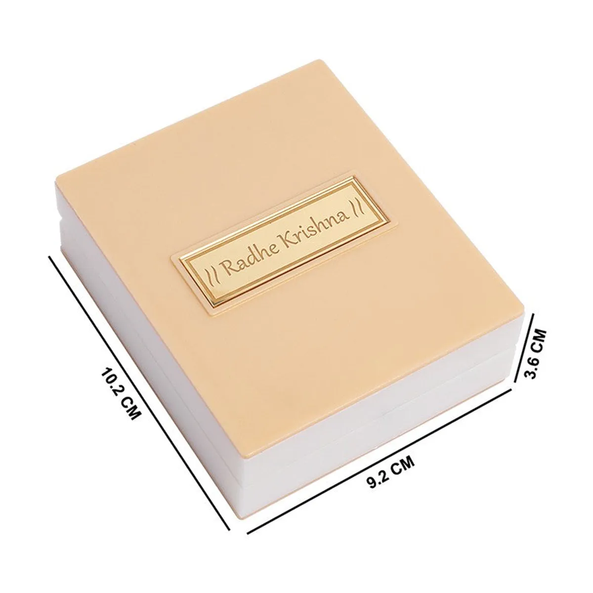 Closed ivory accent box shown at an angle with a central gold-toned nameplate