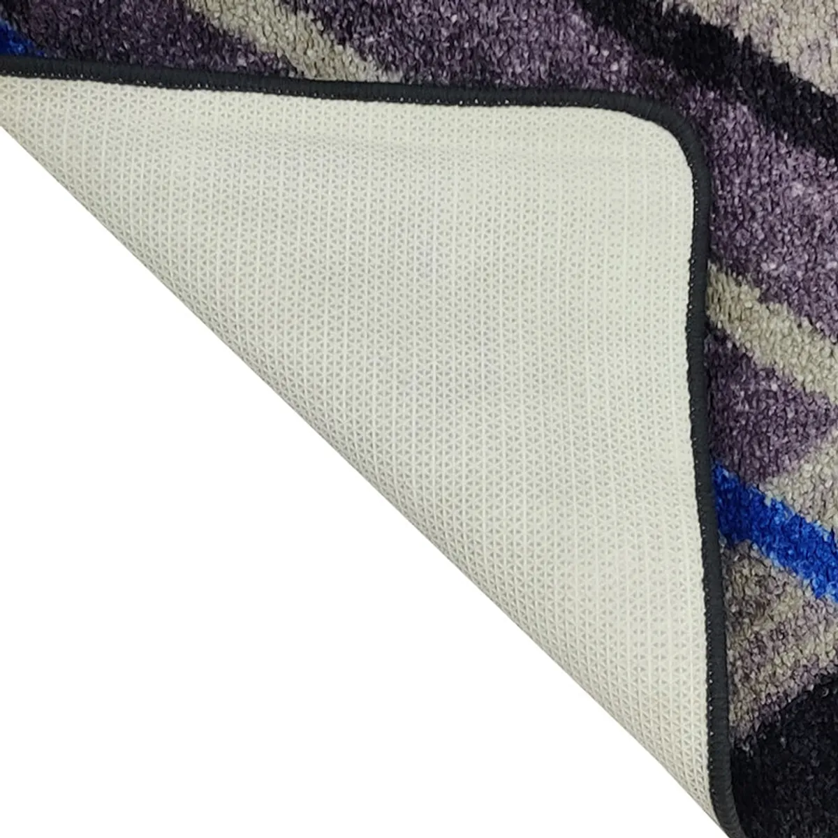 Corner view of the runner rug showing the underside and bound edge