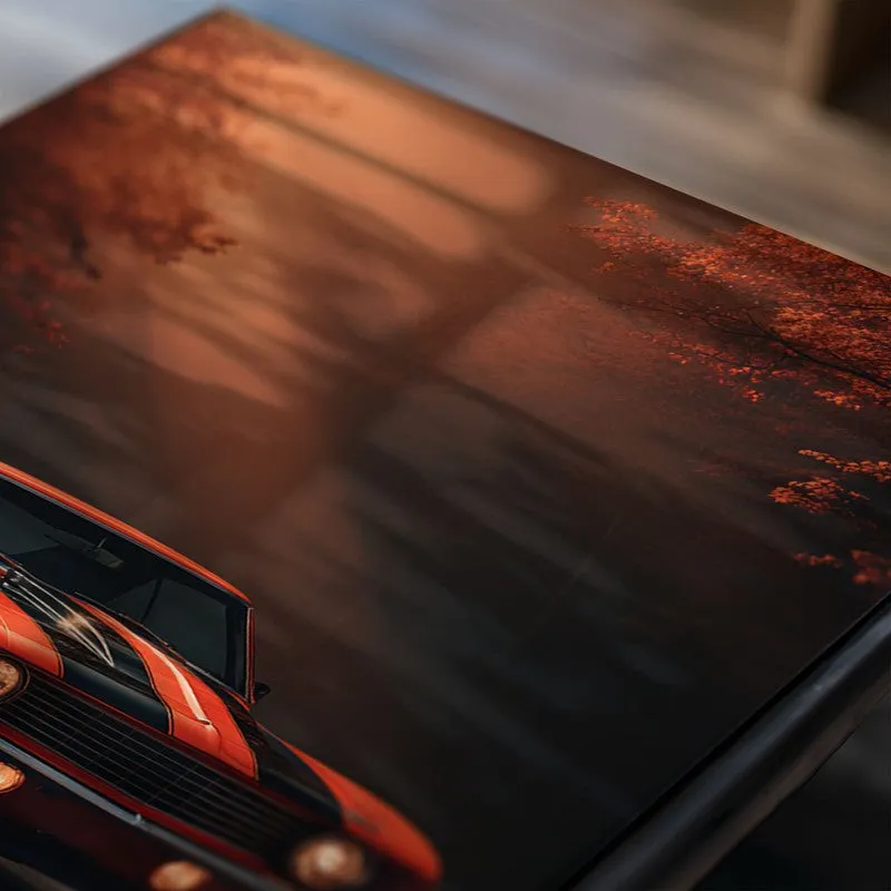 Close-up of a red classic car poster with warm moody background