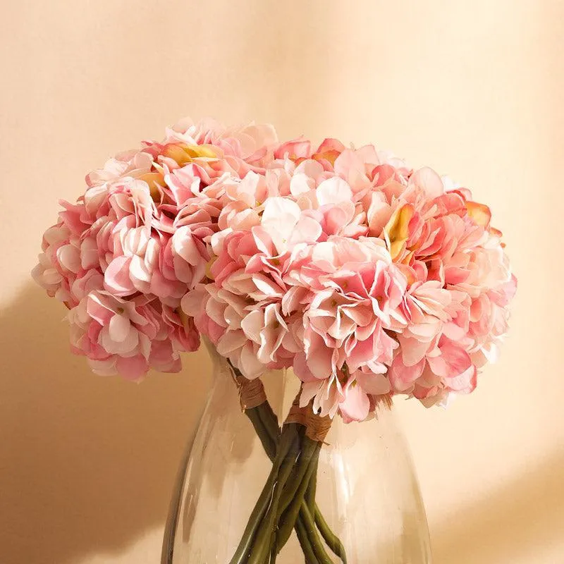 Close-up of clustered pink hydrangea blooms in a vase