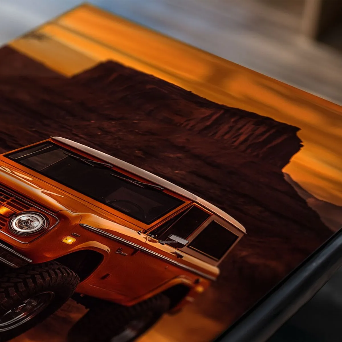 Close-up of an off-road vehicle poster against a sunset desert backdrop