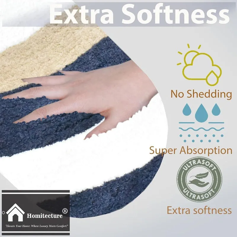 Close-up of the soft textured surface of the blue, white and beige bath mat