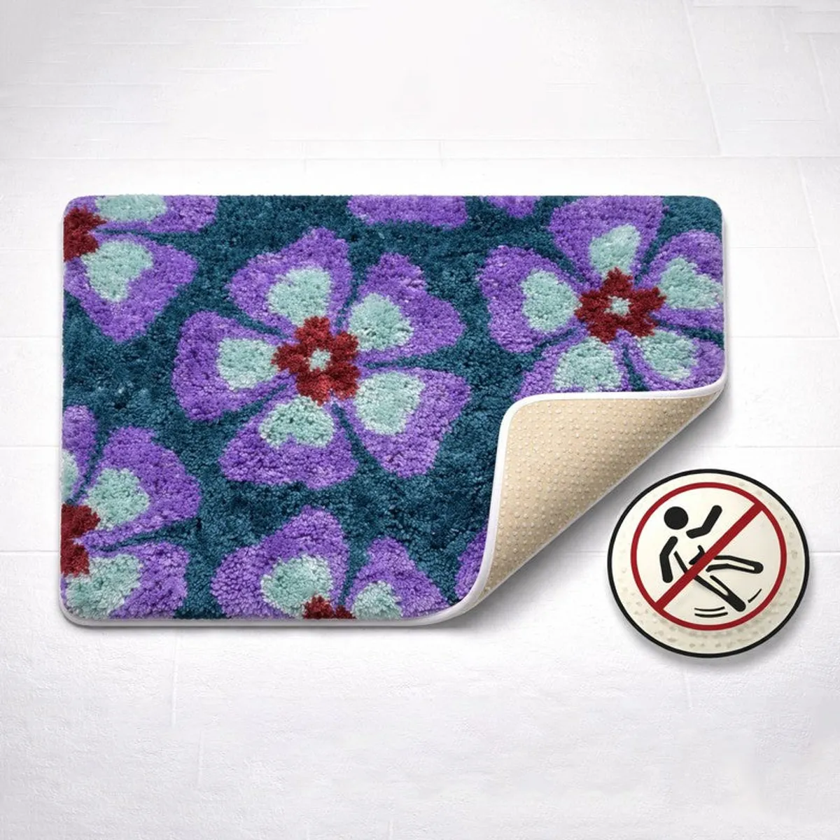 Blue and purple floral bath mat with corner lifted to show backing