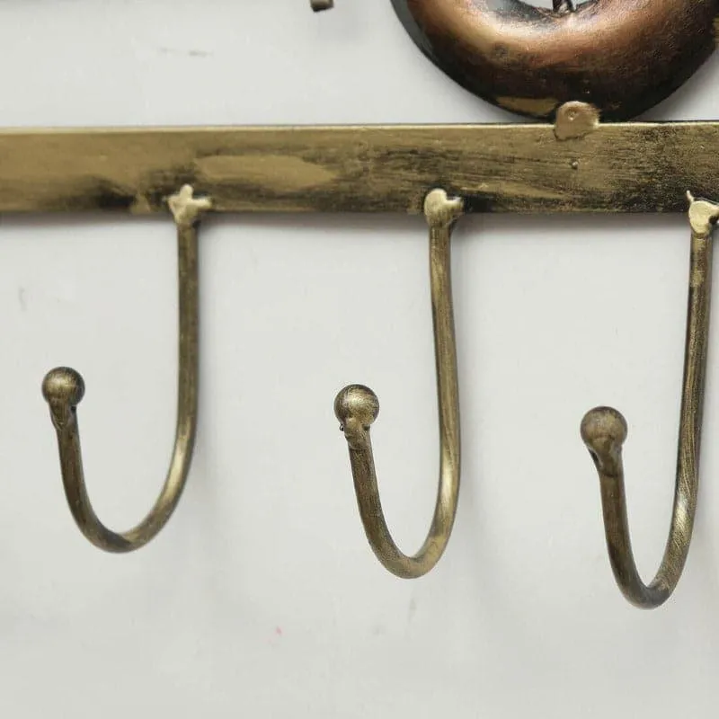 Close-up of the curved metal hooks on the motorcycle key holder