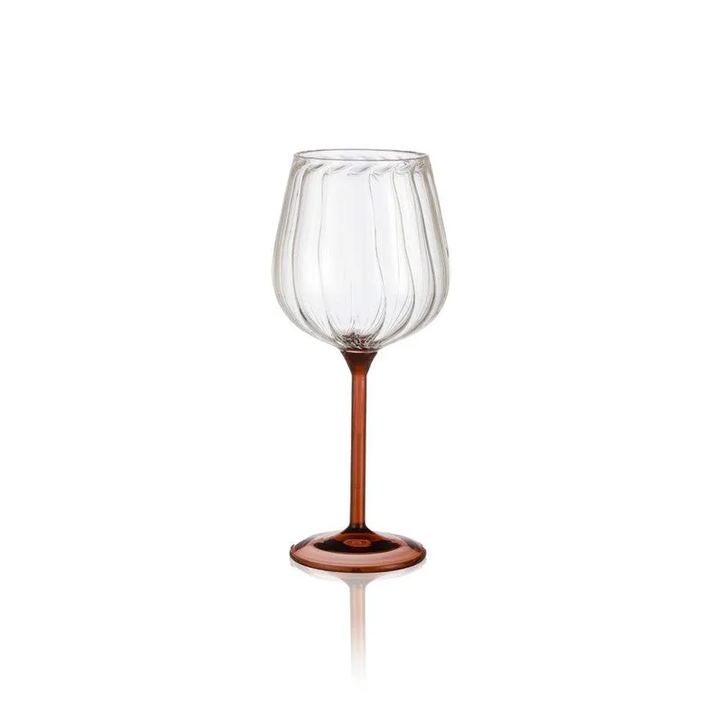 Clear ribbed wine glass with tawny stem shown against a white background