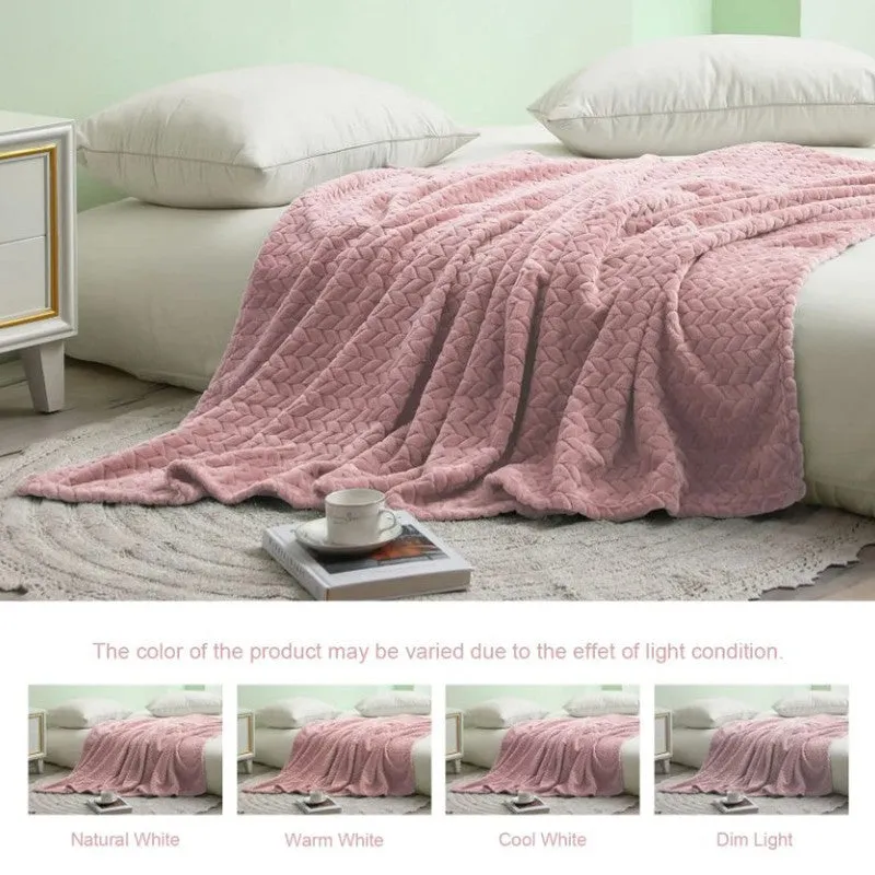 Peach blanket laid across a bed in a bright bedroom