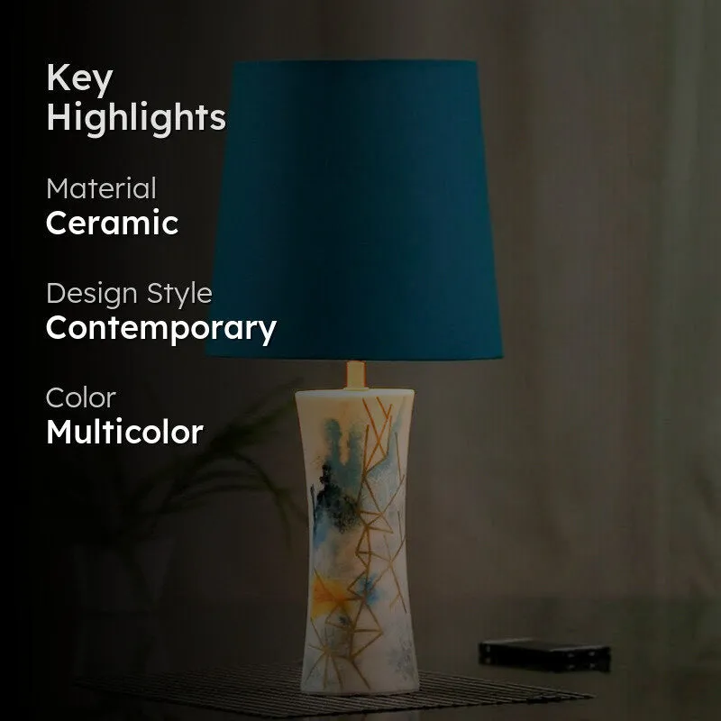 Blue table lamp with multicolour ceramic base and highlight text overlay