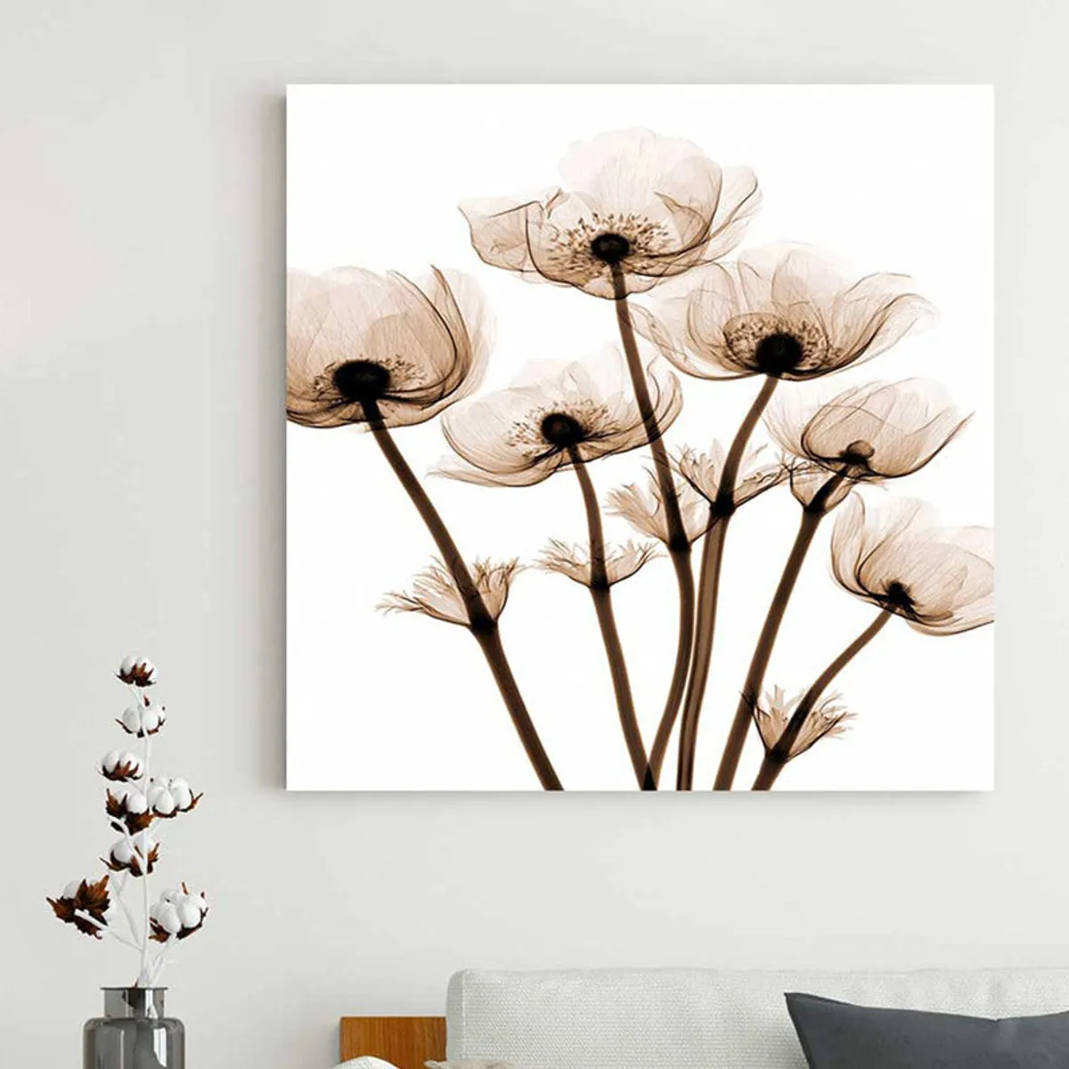 Floral canvas wall art displayed on a light wall above a console setting.