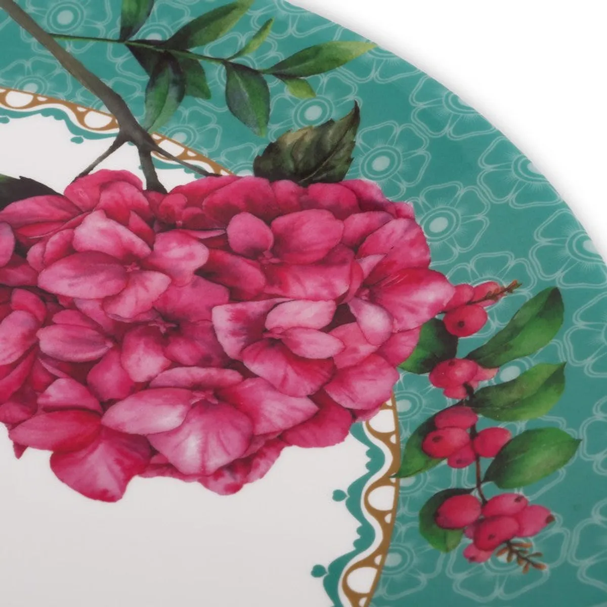 Close-up view of pink floral artwork and turquoise plate detailing
