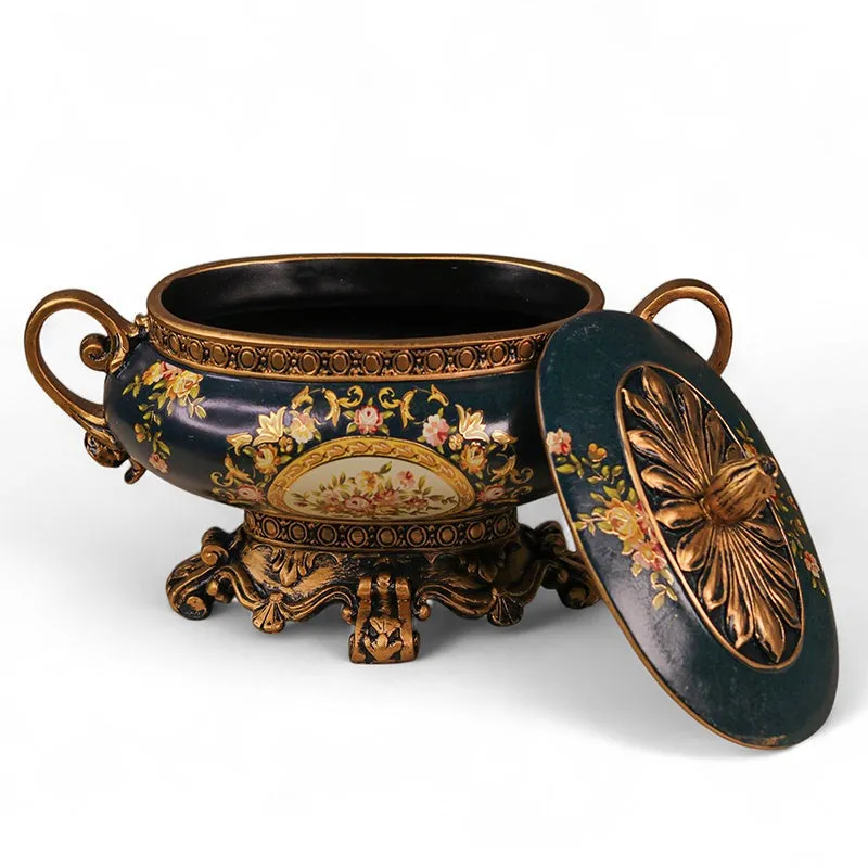 Blue and gold storage box shown open with its decorative lid placed beside it
