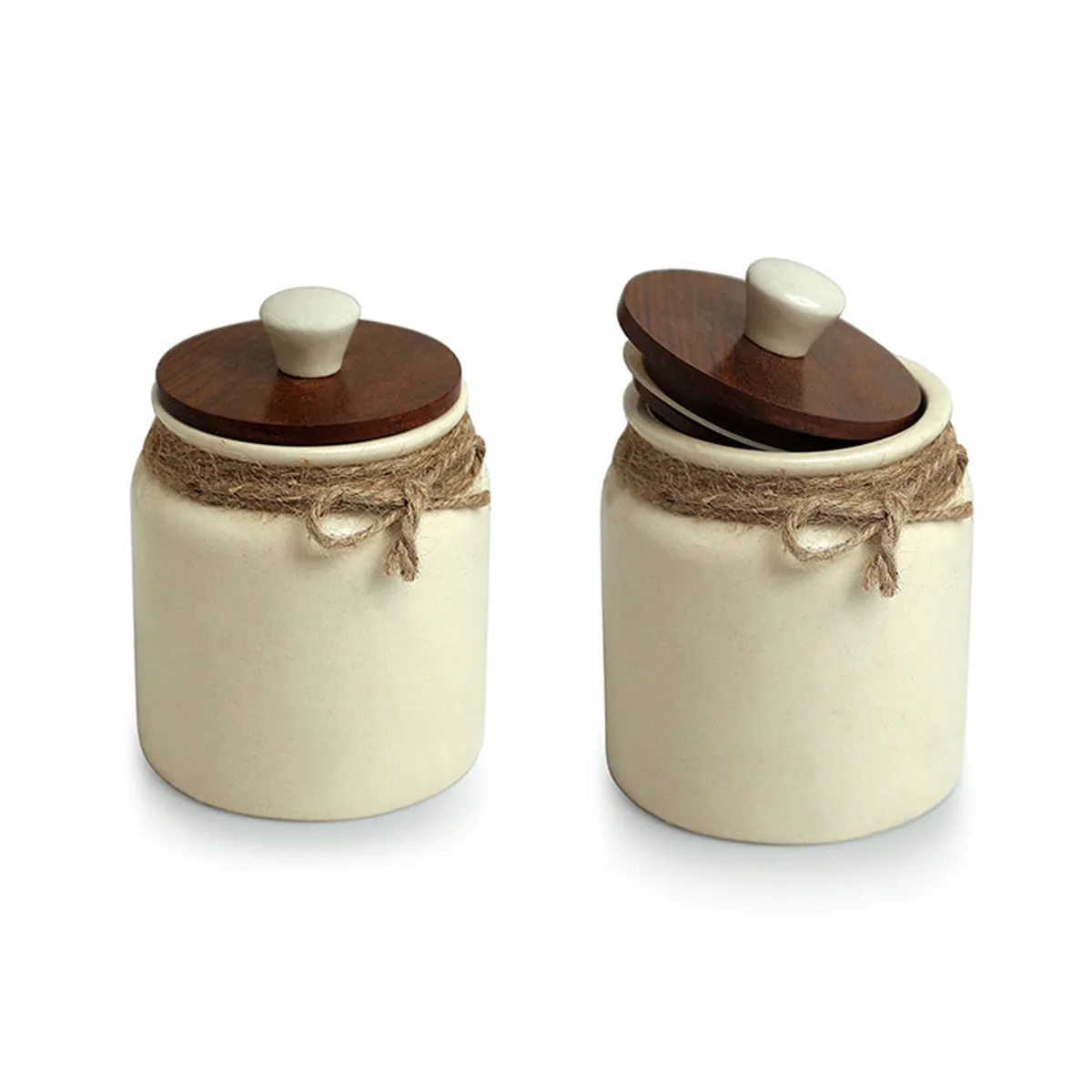 Two white cylindrical ceramic jars with dark wooden lids and jute detailing