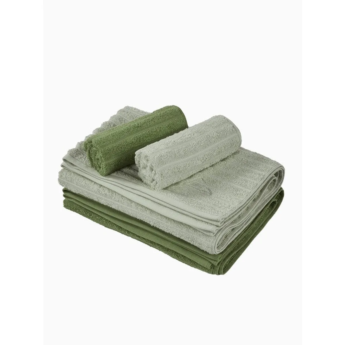 Folded set of green and grey towels on a white background