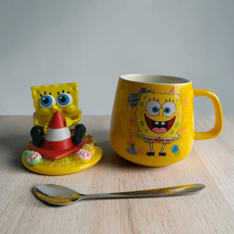Yellow SpongeBob ceramic mug with figurine lid and spoon
