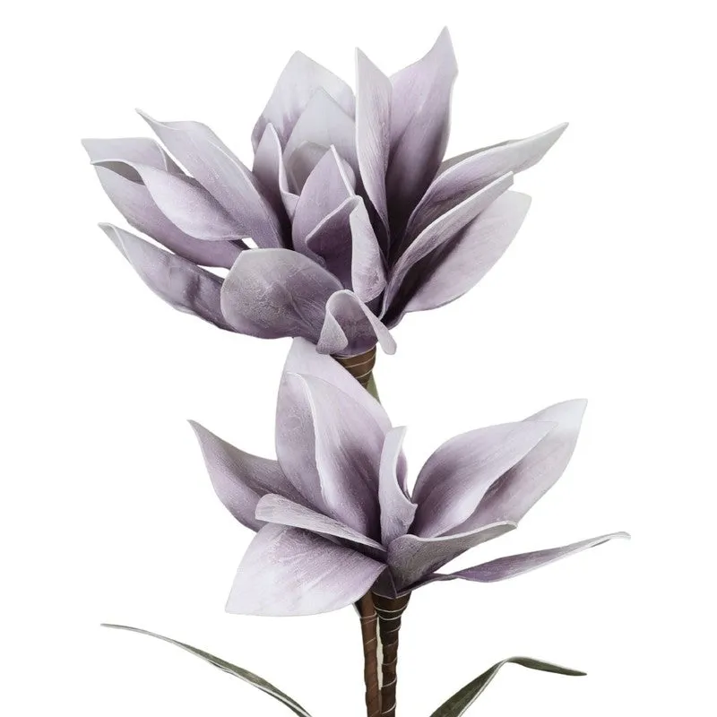 Detailed view of layered purple artificial flower petals and leaves