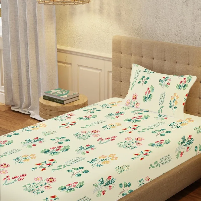 Single bed styled with a white floral fitted bedsheet and matching pillow cover