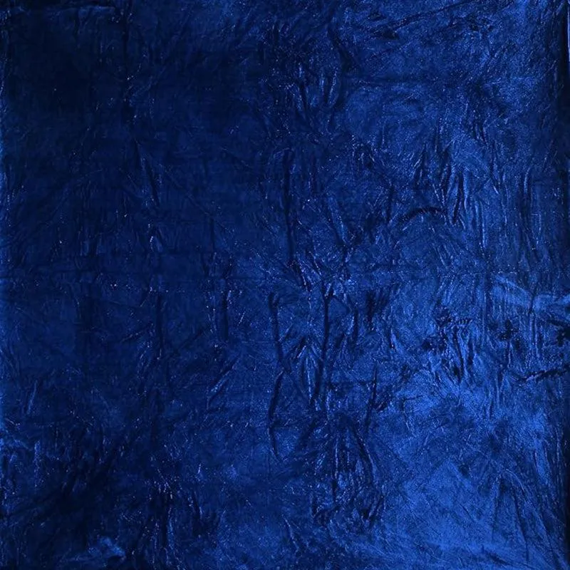 Close-up of dark blue bedsheet surface with subtle textured look
