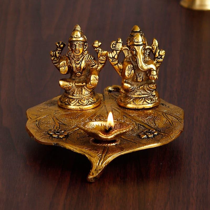 Sacred Lakshmi Ganesha Idol Metal Diya Stand - Gold