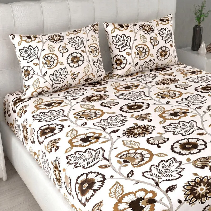 Close view of white and brown floral bedsheet with matching pillow covers