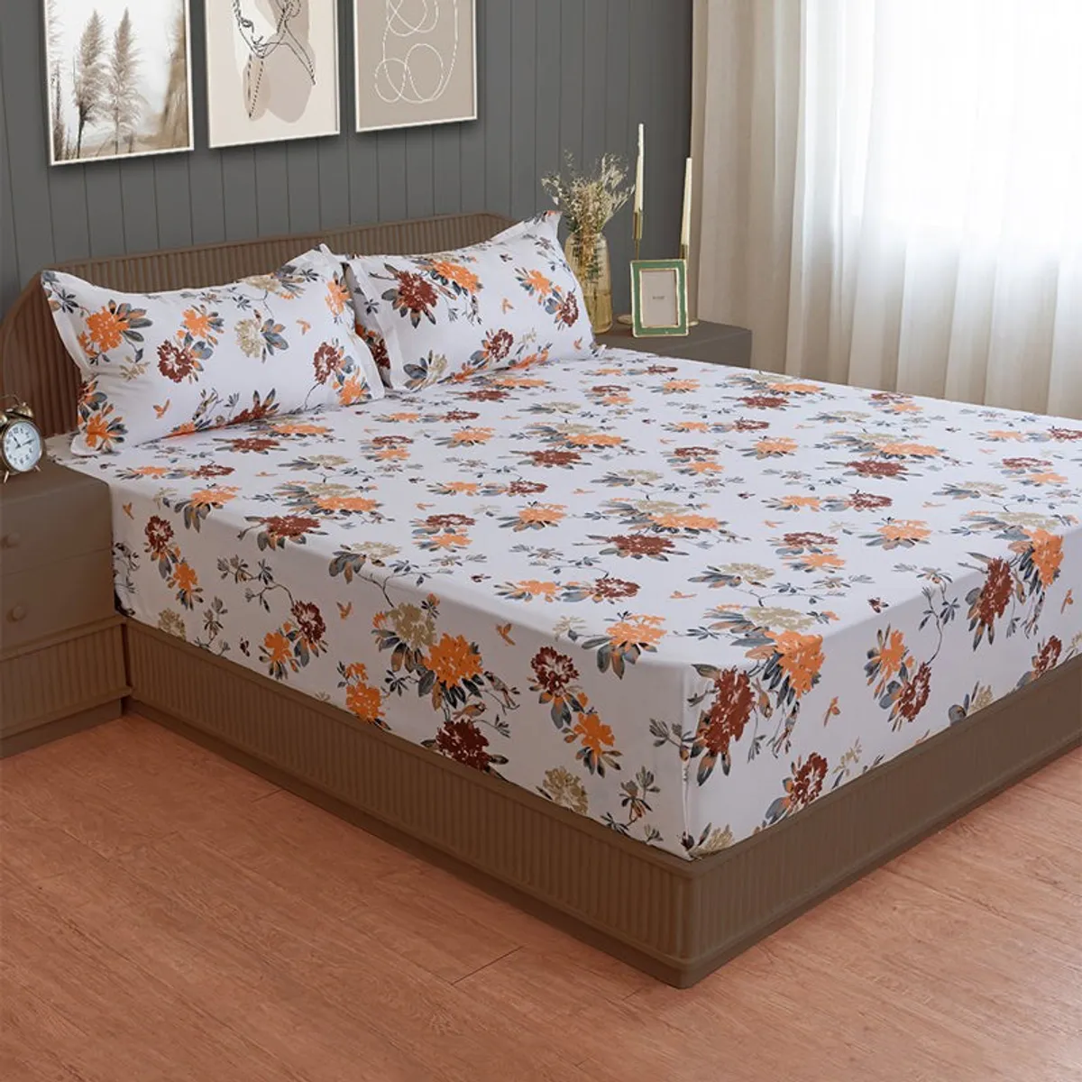Angled view of white floral bedsheet with matching pillow covers