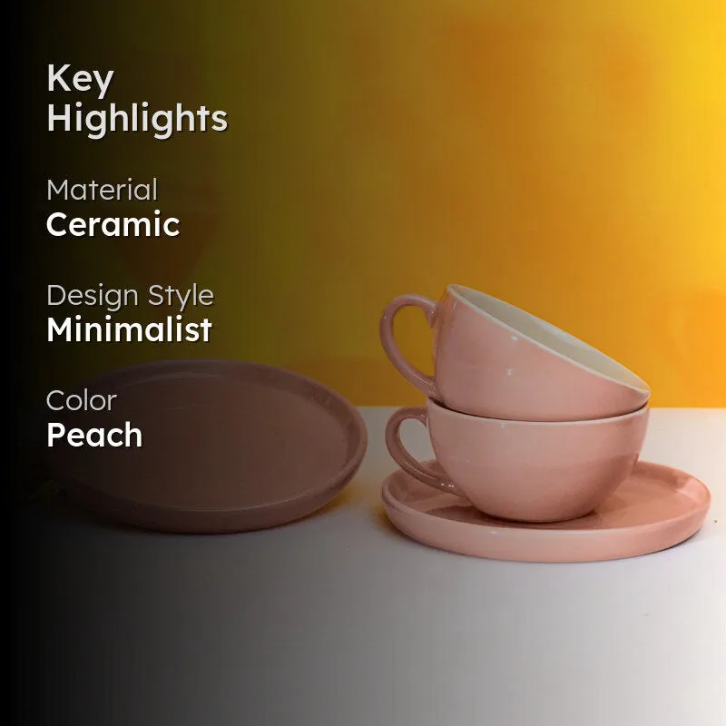 Peach-pink cups and saucers displayed against a warm background