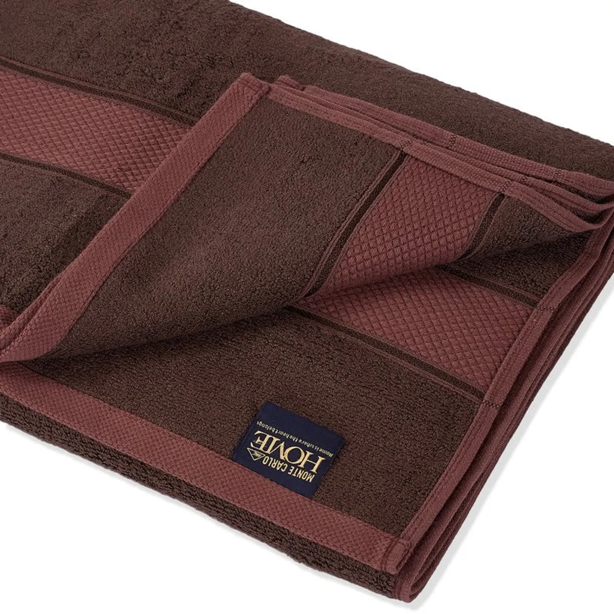 Close-up of the coffee brown towel showing its plush surface and border details.