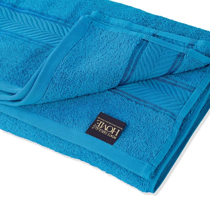Close-up of vivid blue cotton bath towel with border detail
