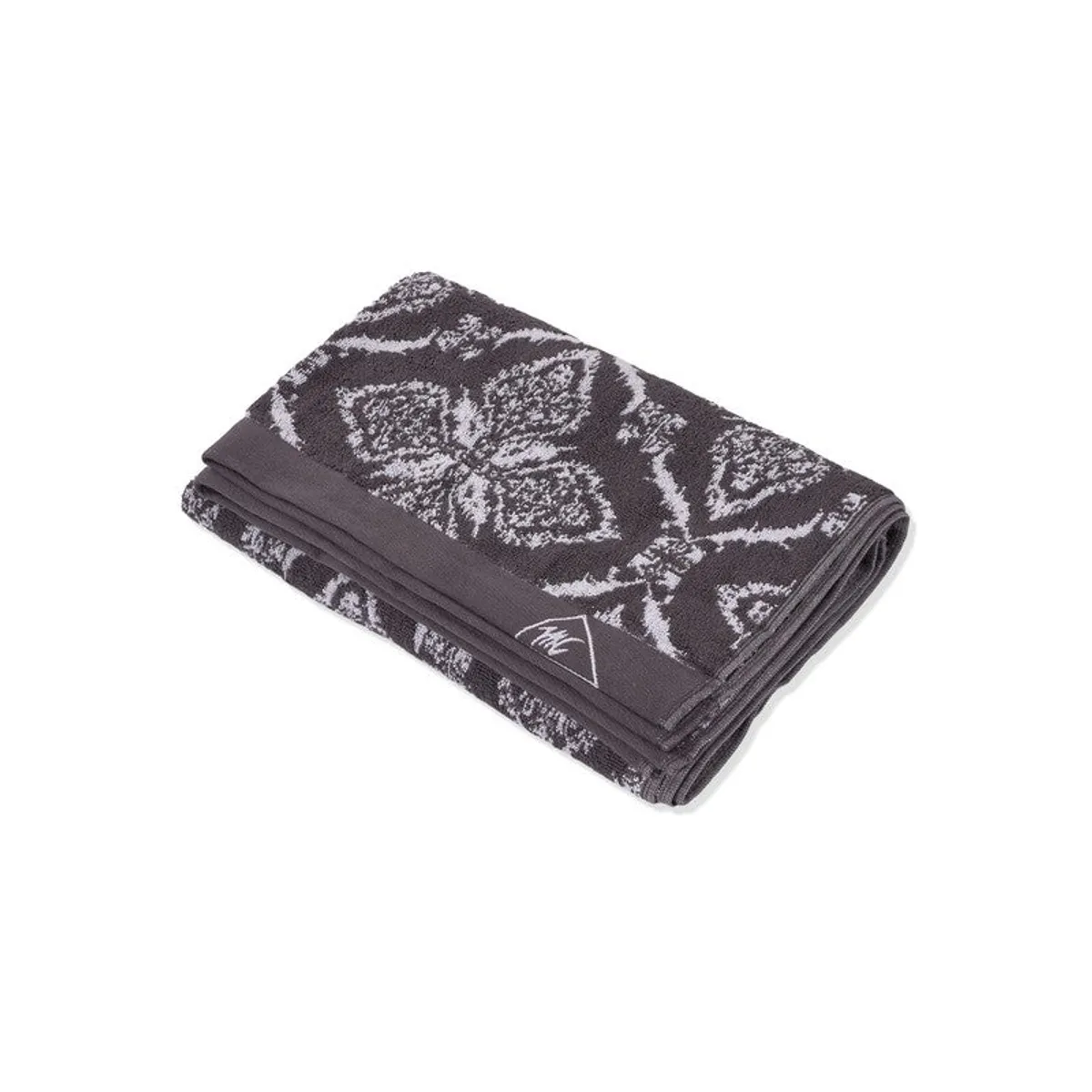 Folded grey floral bath towel shown against a white background