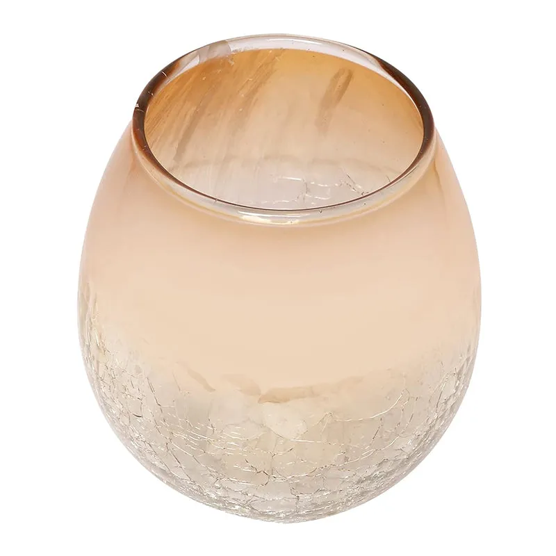 Golden glass tealight holder with a rounded shape and crackle-textured lower section