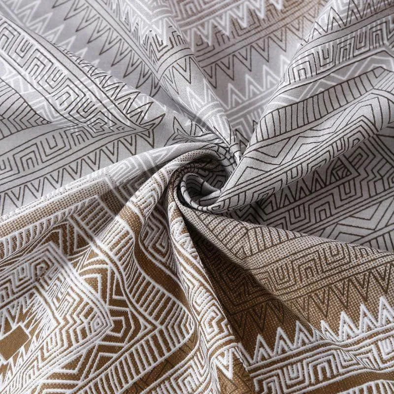 Close-up of the printed cotton bedsheet fabric gathered to show drape