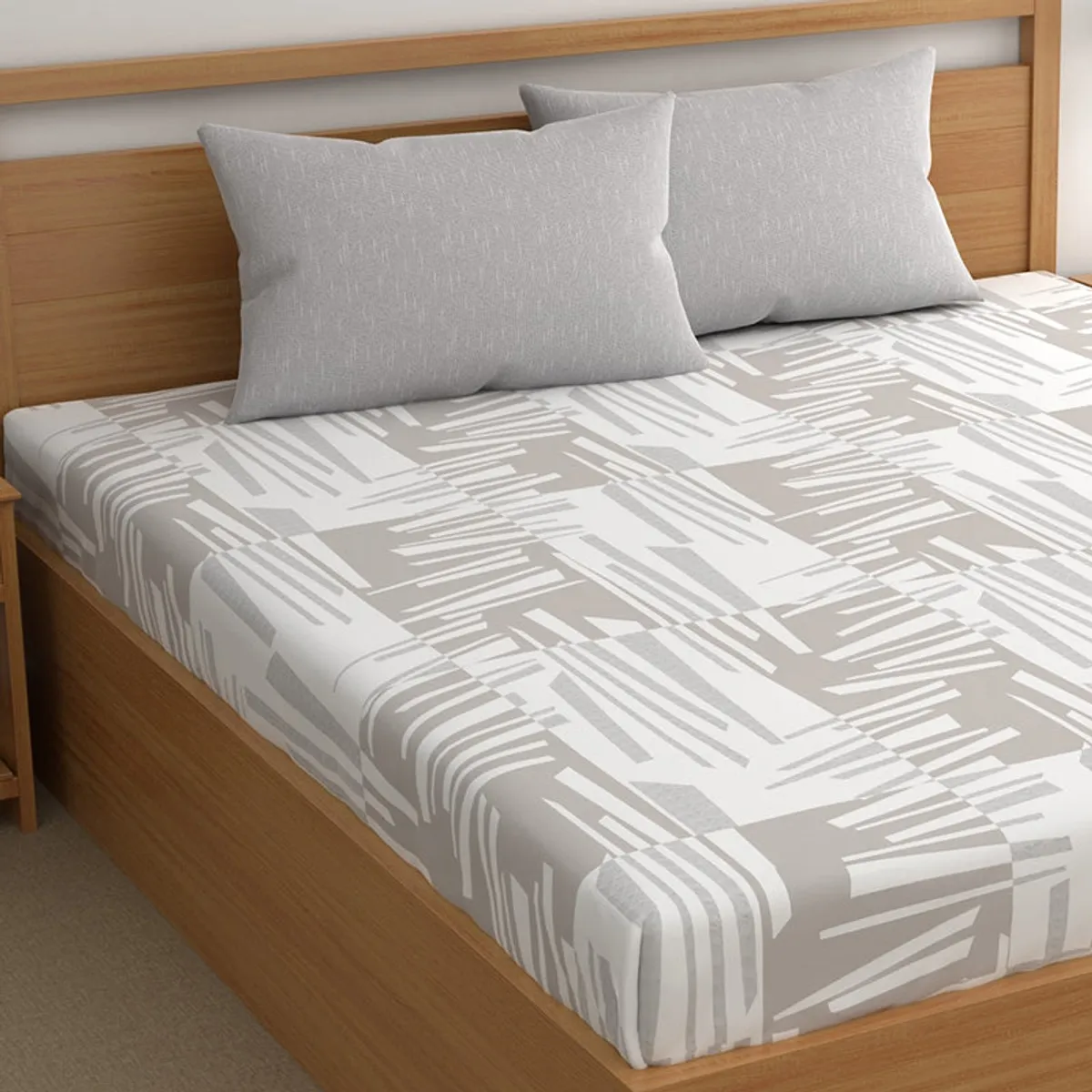 Abstract grey and white flat bedsheet draped over a bed
