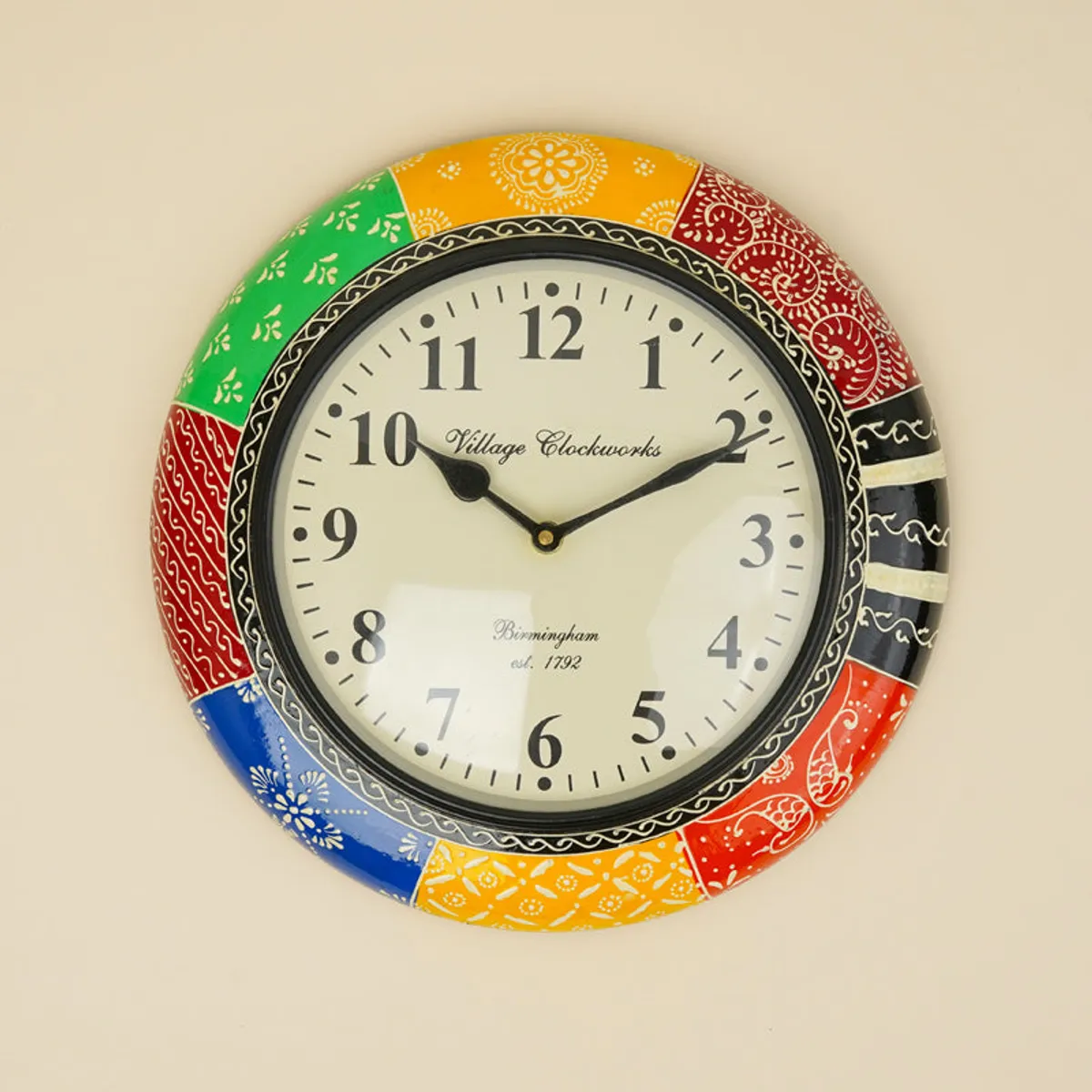 Front view of a colourful round analogue wall clock