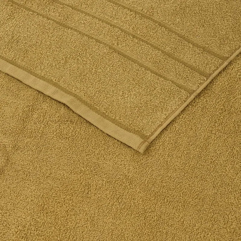 Close-up of olive green towel texture and woven border stripes