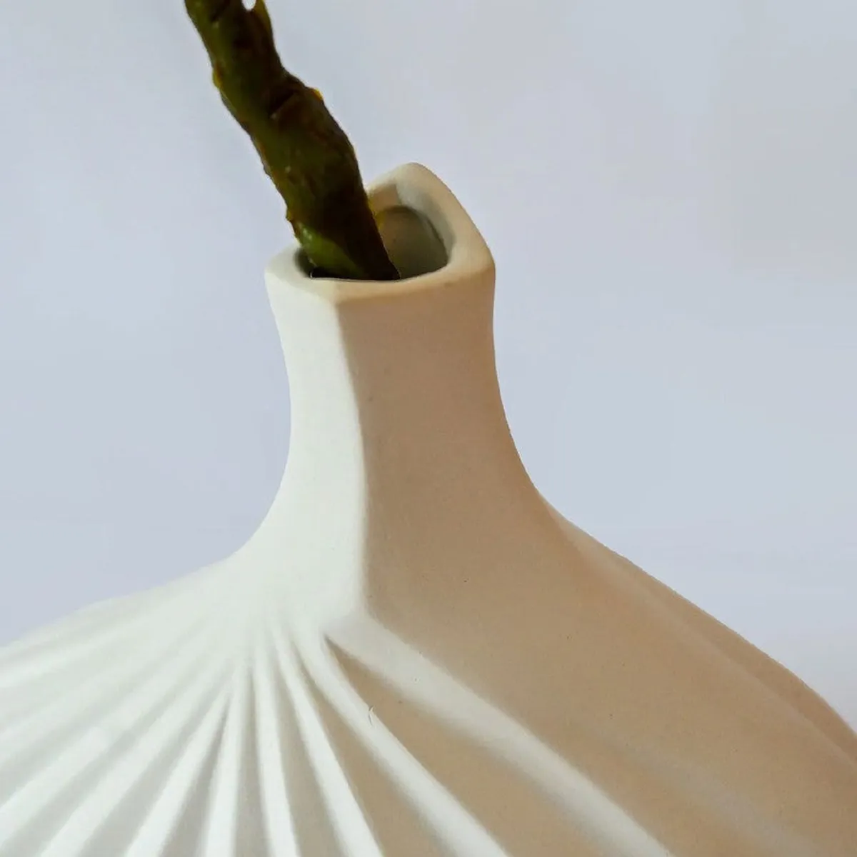 Close-up of the vase neck and raised vertical ribbing