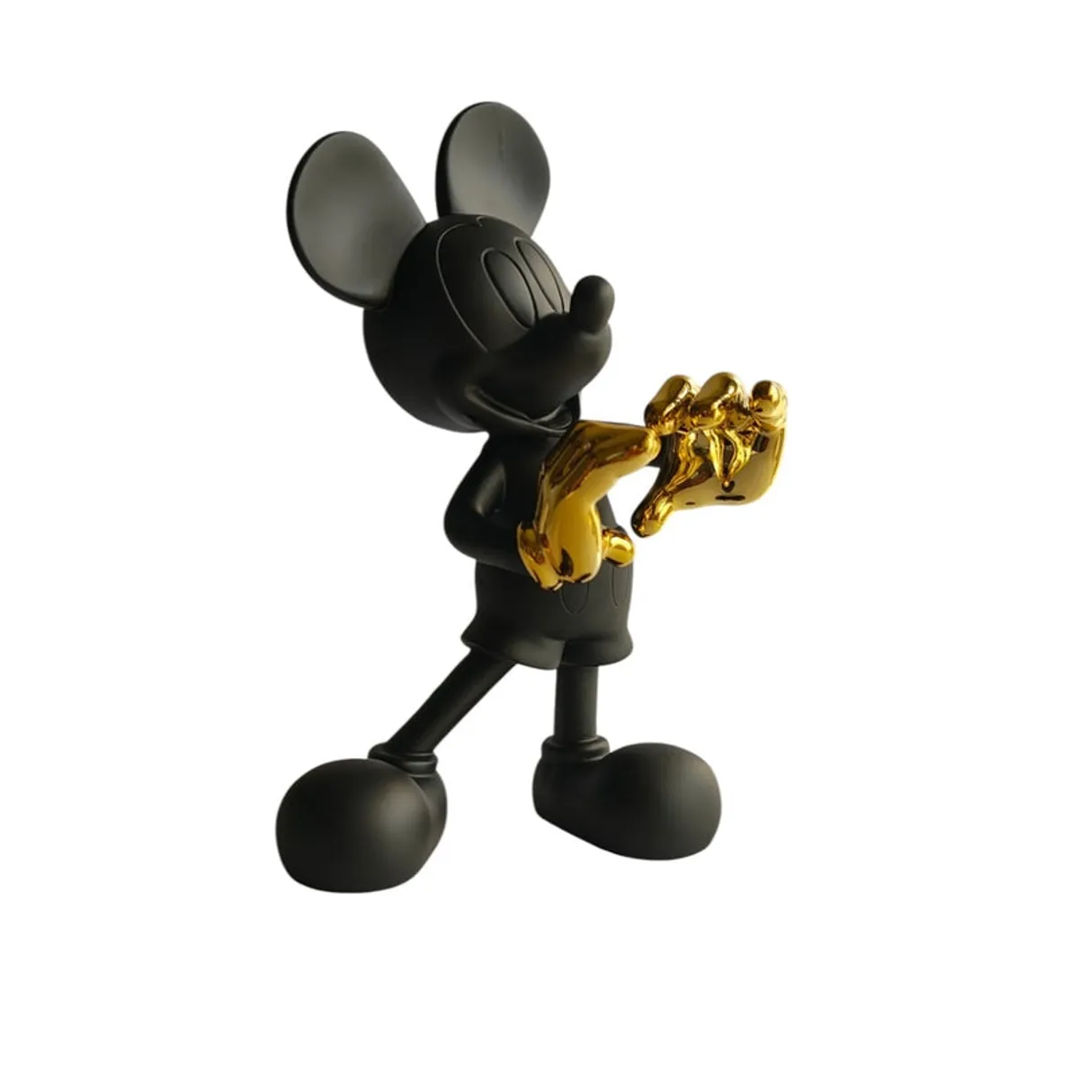 Angled side view of the black figurine with gold gloves on a white background.