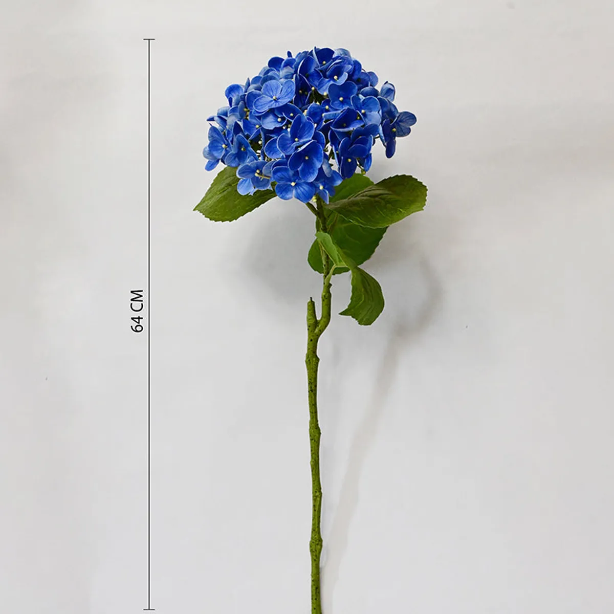 Blue, pink, white and purple hydrangea sticks arranged in a vase