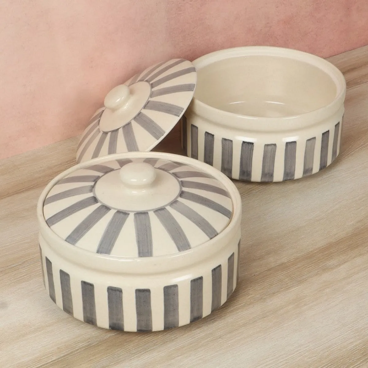 Two contemporary grey and white ceramic serving bowls with matching lids