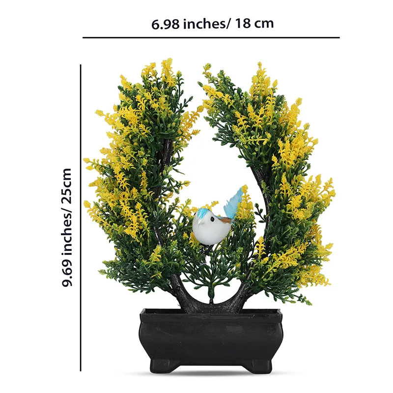 Artificial plant with bird detail displayed in a black pot against a white background