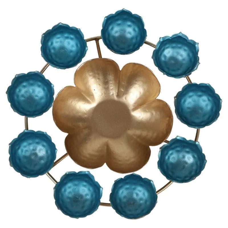 Top detail of the gold floral centre surrounded by blue flower-shaped holders