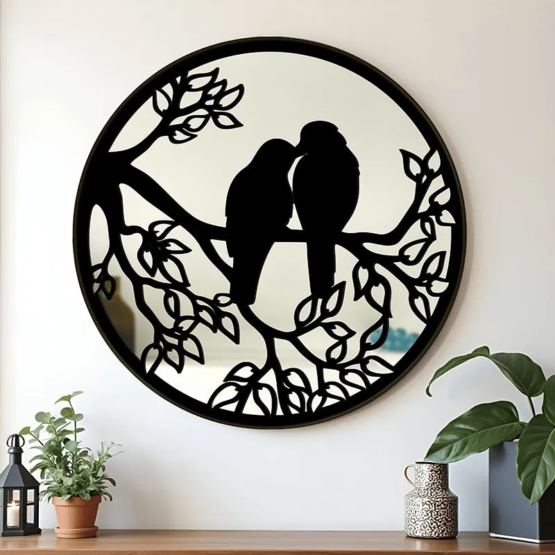 Round black wall mirror with two birds on branches
