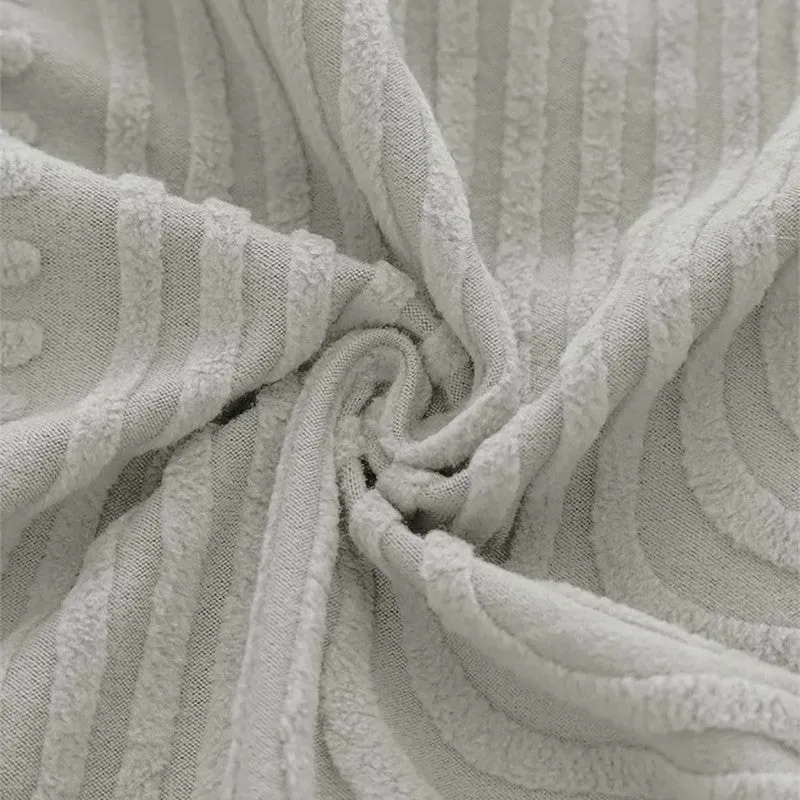 Close-up of soft grey textured chair cover fabric