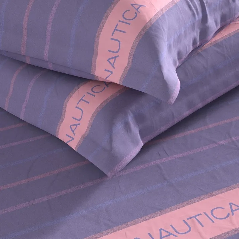 Close-up of purple bedsheet and pillow covers with pink striped detailing